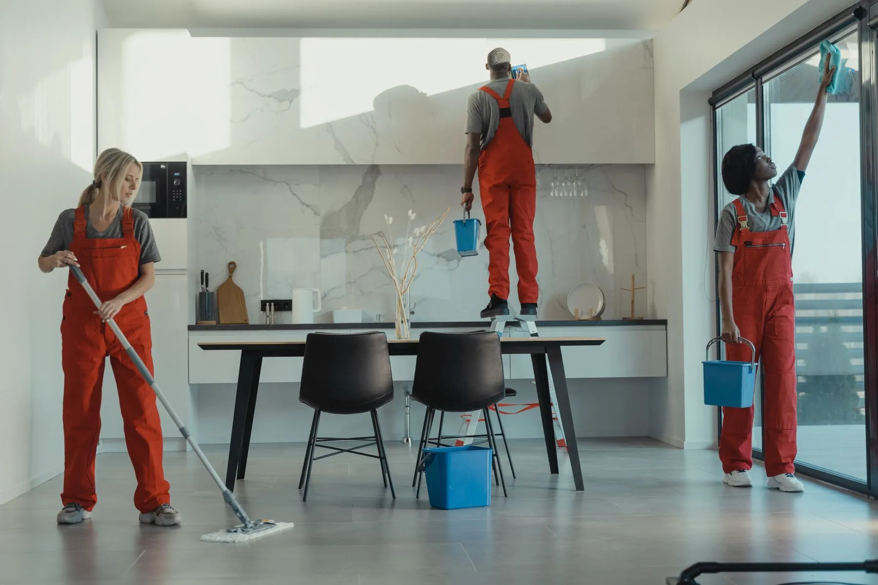 Uniformed cleaning team maintaining a modern commercial space